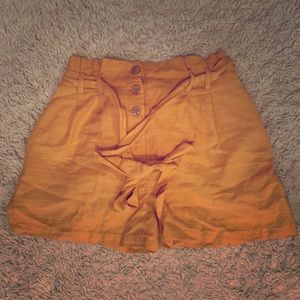 Yellow tie waist shorts.